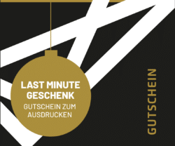 Vorderseite eines Last Minute Gutscheins von feine art mit stilisiertem Weihnachtskugel-Design in Schwarz, Weiß und Gold.